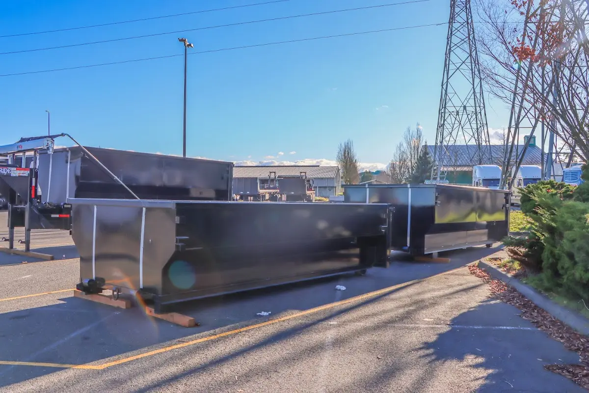 Roll-off dumpster ready for waste disposal at job site for Demolition Dumpster Rental in Jeffersonville